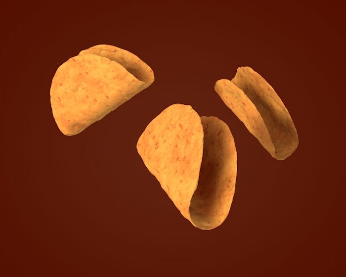 Three shell-shaped chips in 3D, falling against a dark red backdrop