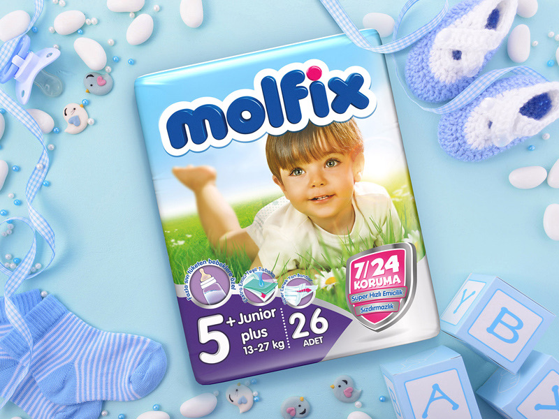 A Molfix Junior pack among baby socks, toys and blocks