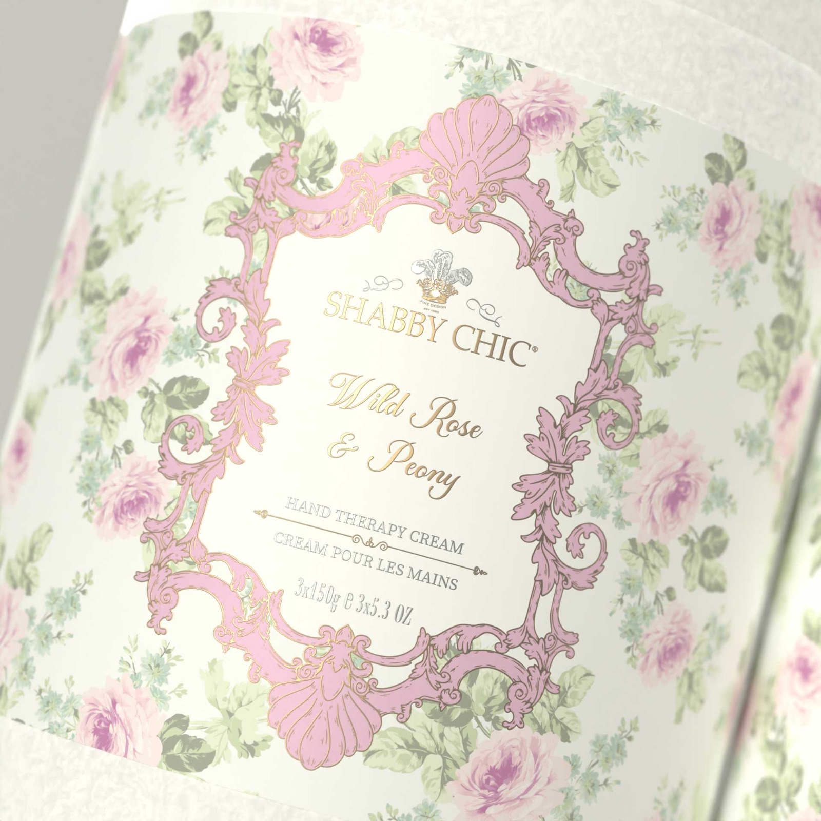 An ornate pink framed label over a floral pattern, close up