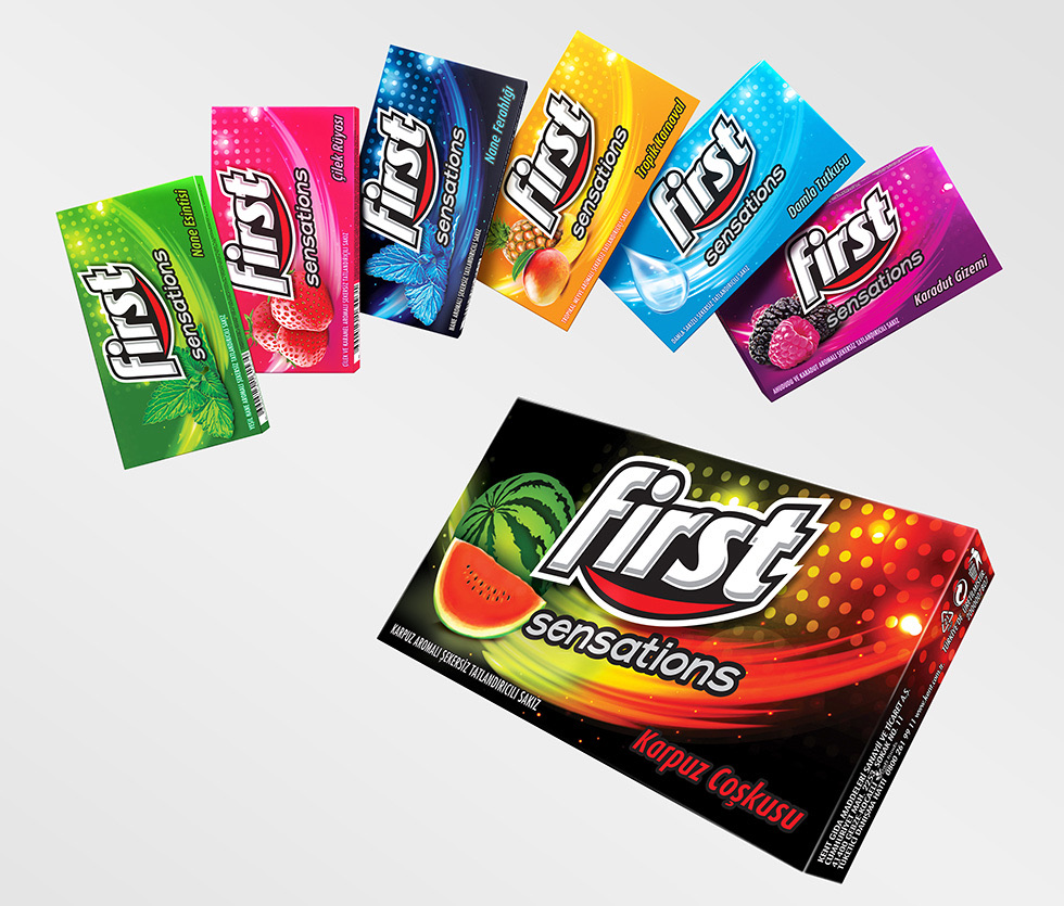 First chewing gum packs fanned out in six flavour colours above a First Sensations pack