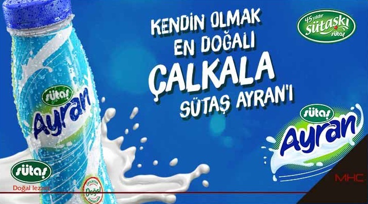 A Sütaş advertisement: the Ayran bottle in a splash, with the line Kendin olmak en doğalı, çalkala Sütaş Ayran'ı