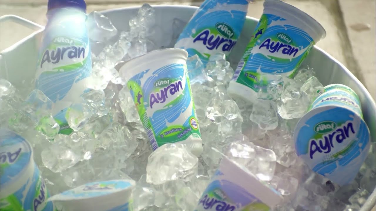 A still from a Sütaş commercial: Ayran cups and bottles in a tub of ice